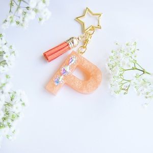 Peach bling resin letter “P” keychain